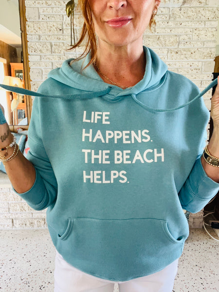 LIFE HAPPENS. THE BEACH HELPS HOODIE